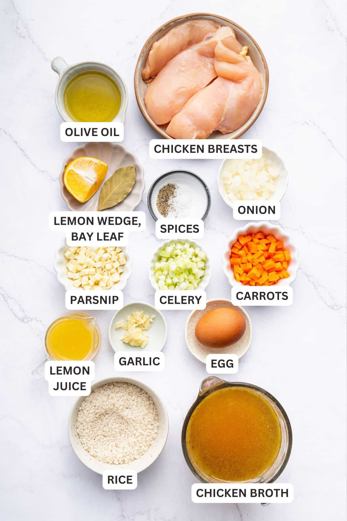 Overhead view of ingredients for avgolemono soup with labels