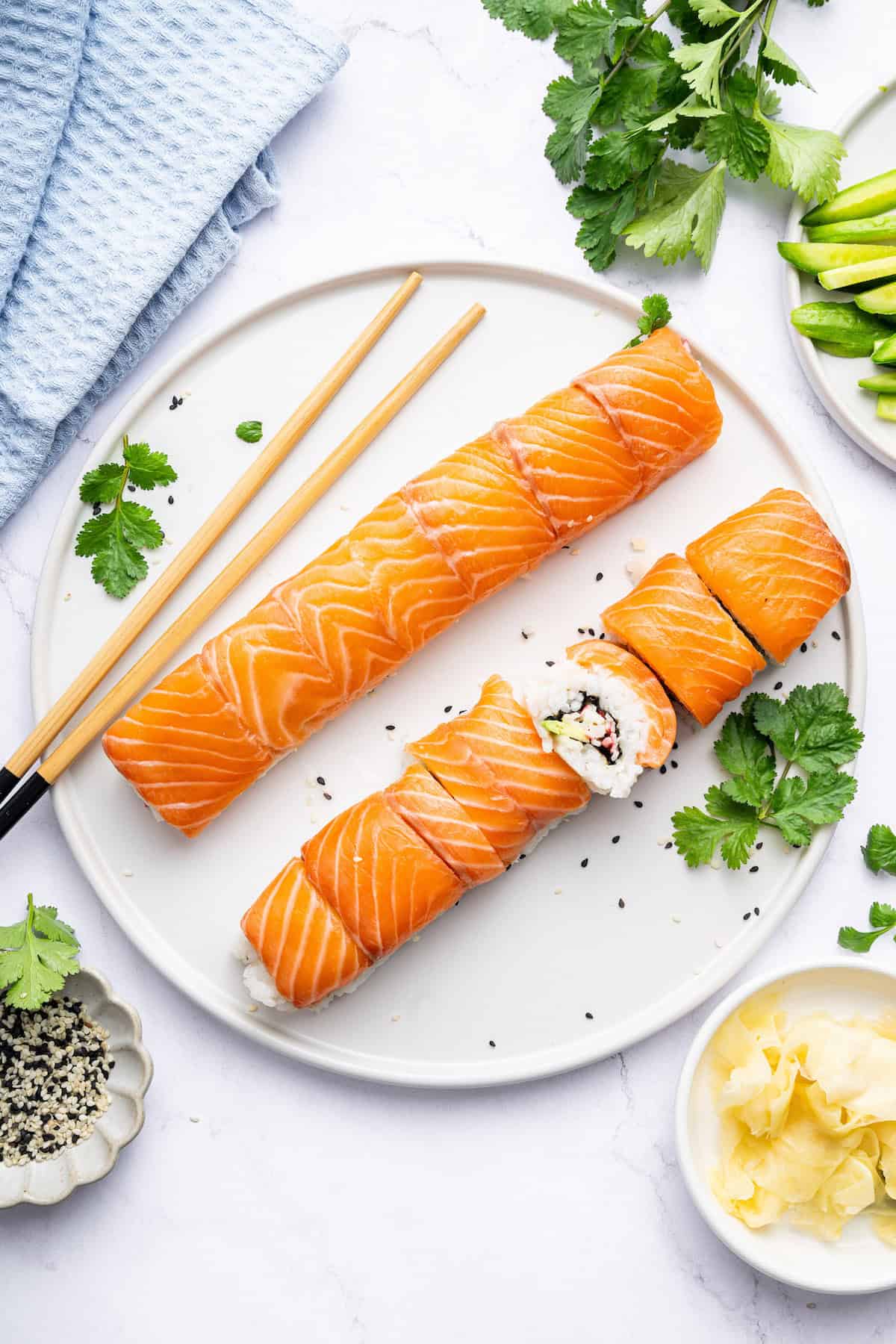 Overhead view of sliced Alaska rolls on plate