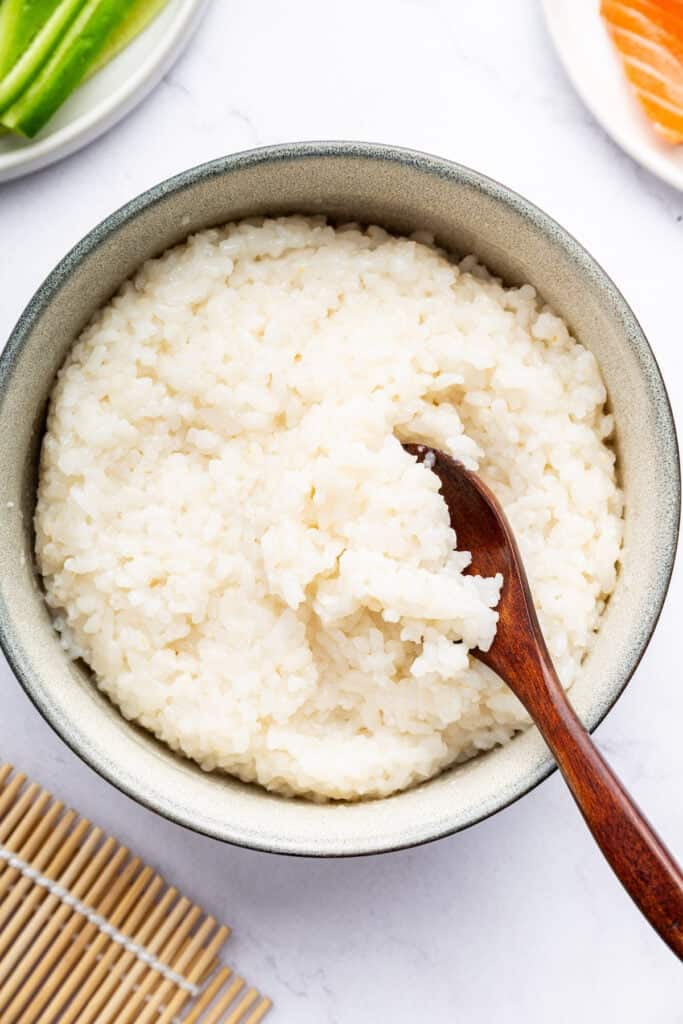 Overhead view of Instant Pot sushi rice in bowl with spoon