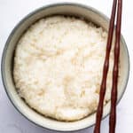 Overhead view of Instant Pot sushi rice in bowl with chopsticks