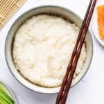 Overhead view of Instant Pot sushi rice in bowl with chopsticks