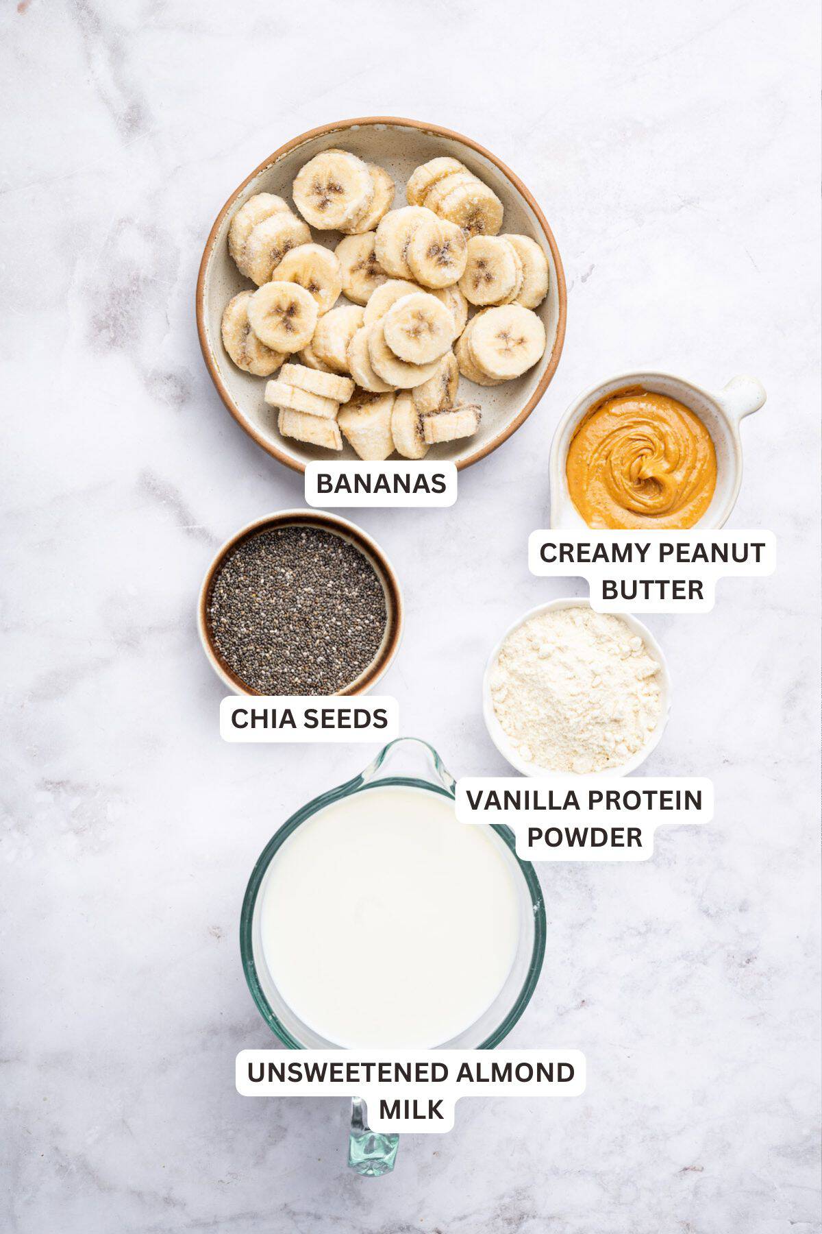 Overhead view of ingredients for peanut butter banana smoothie