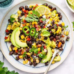 Black bean and corn salad on plate with fork