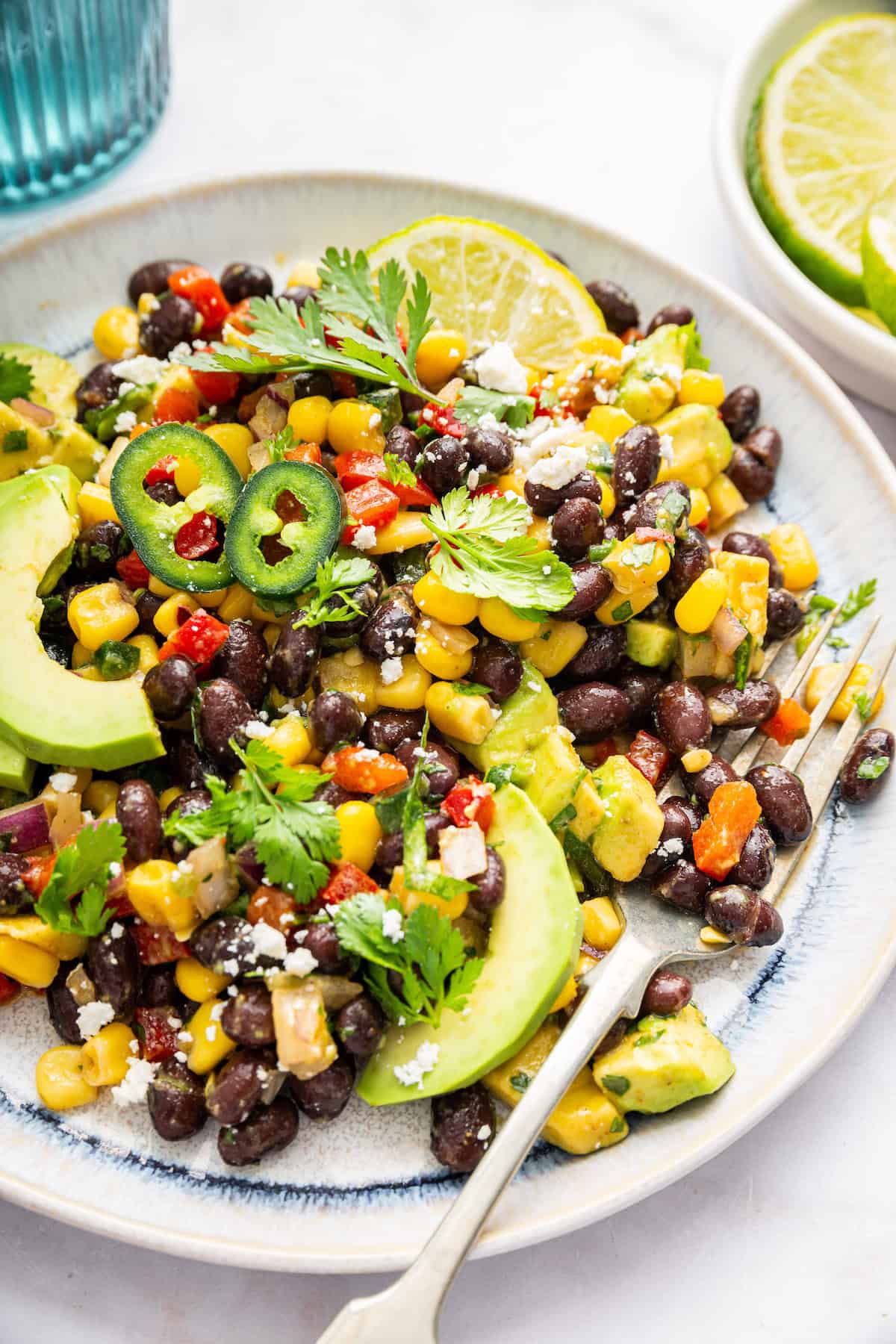 Black bean and corn salad on plate with fork