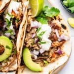 Tacos made with Instant Pot pork carnitas on plate