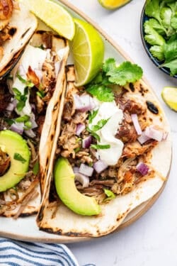 Tacos made with Instant Pot pork carnitas on plate