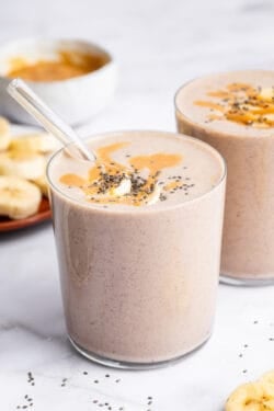 Peanut butter banana smoothie in two glasses