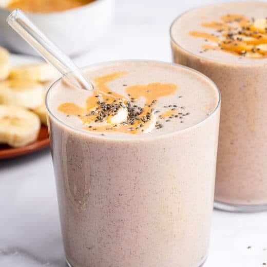 Peanut butter banana smoothie in two glasses