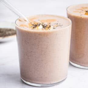 Two glasses with peanut butter banana smoothie