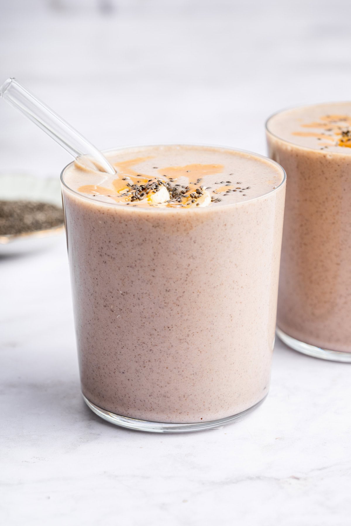 Two glasses with peanut butter banana smoothie