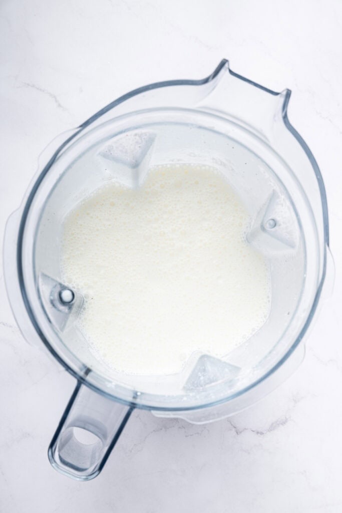 Overhead view of cottage cheese sauce in blender