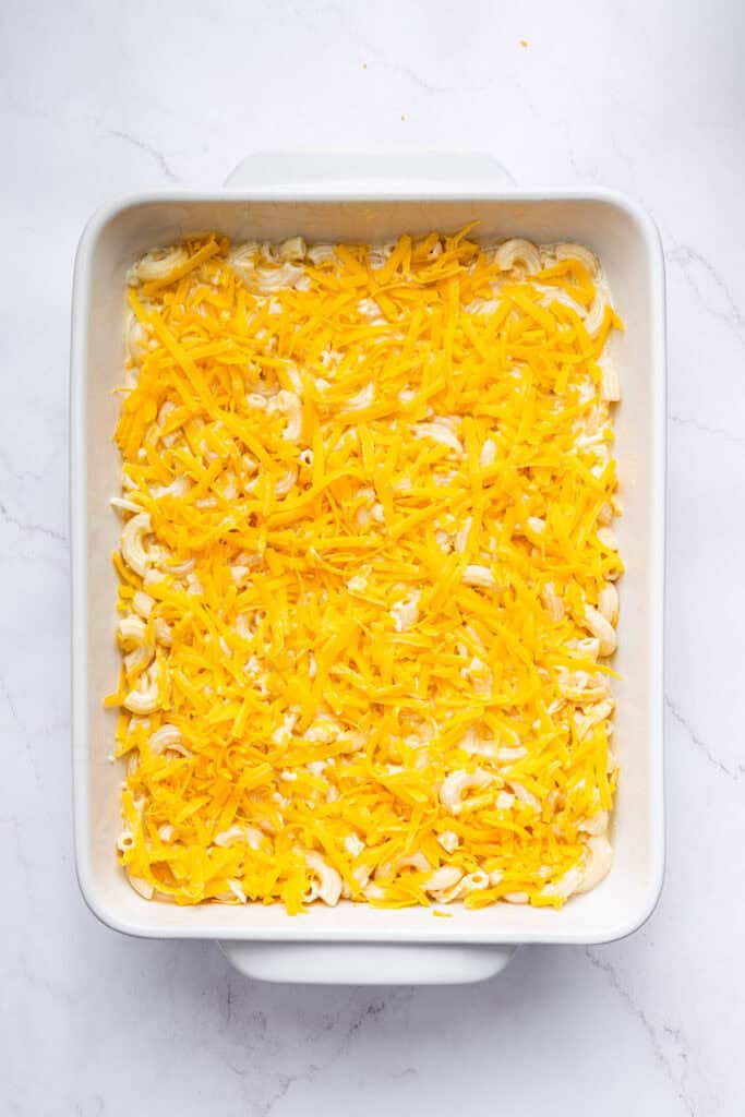 Overhead view of protein mac and cheese in baking dish before baking