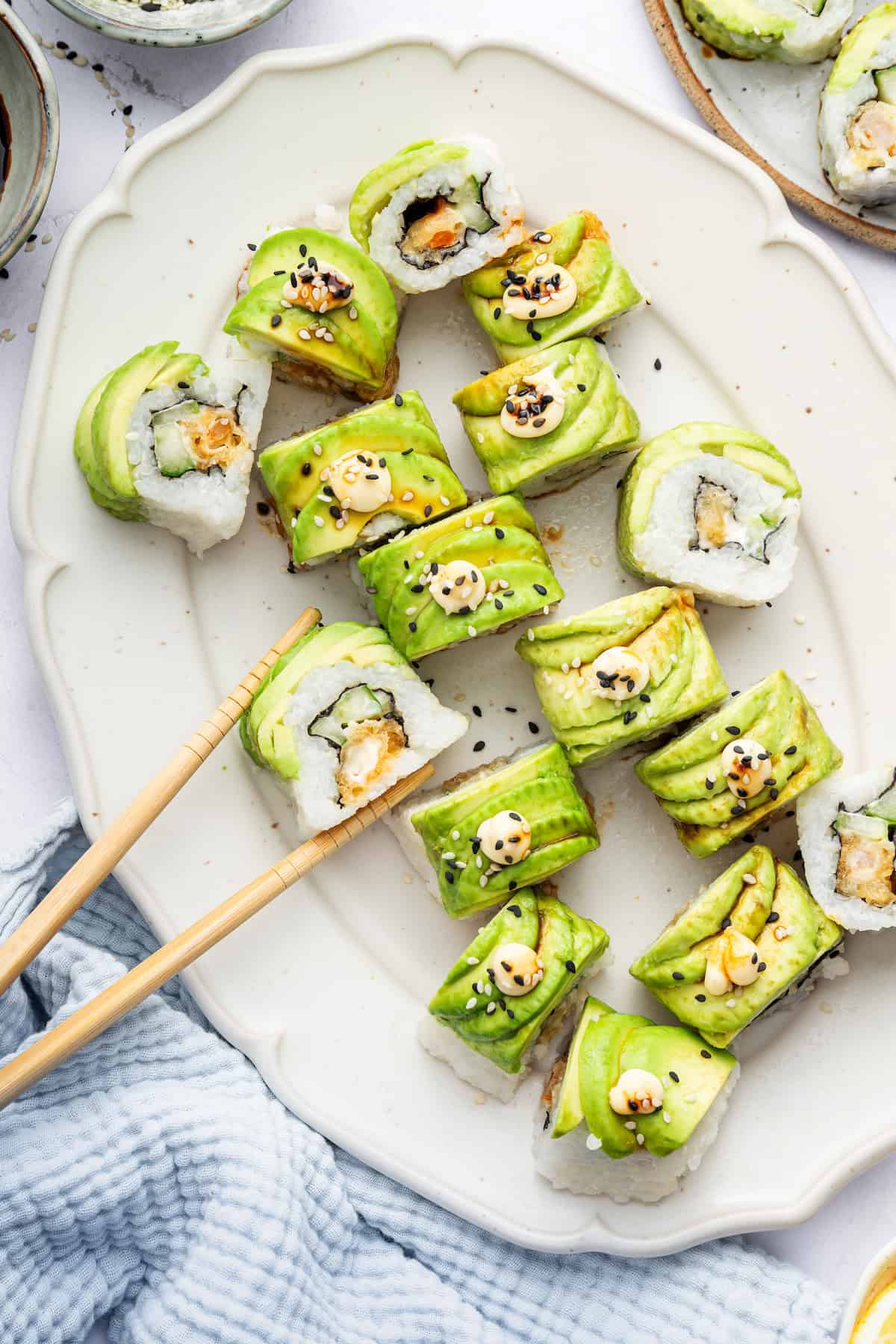 Platter of dragon rolls with chopsticks