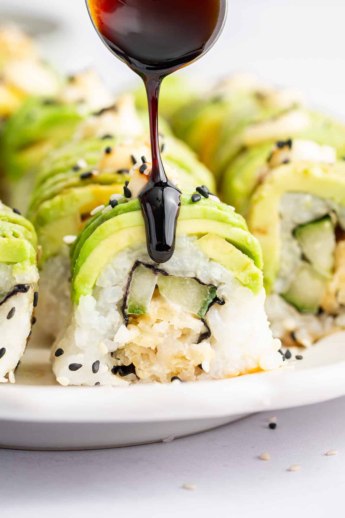 Drizzling unagi over dragon roll