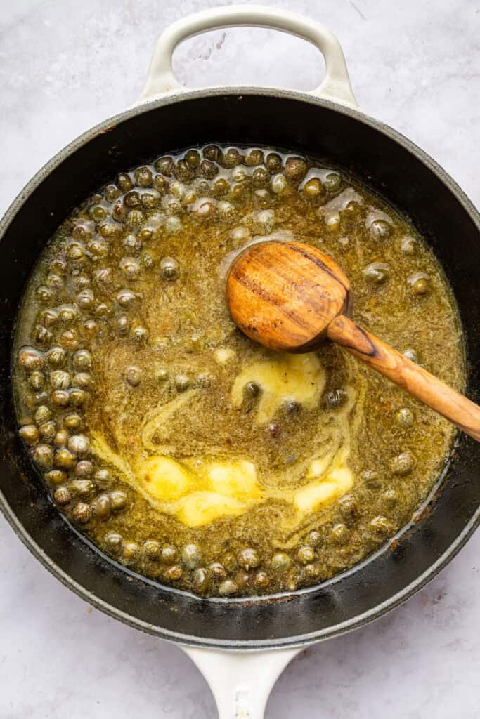 Butter melting in lemon caper sauce