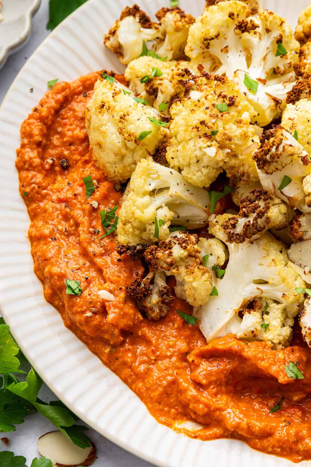 Cauliflower served in bowl with romesco sauce