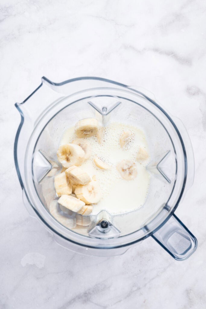 Milk and bananas in blender