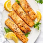Overhead view of air fryer frozen salmon fillets