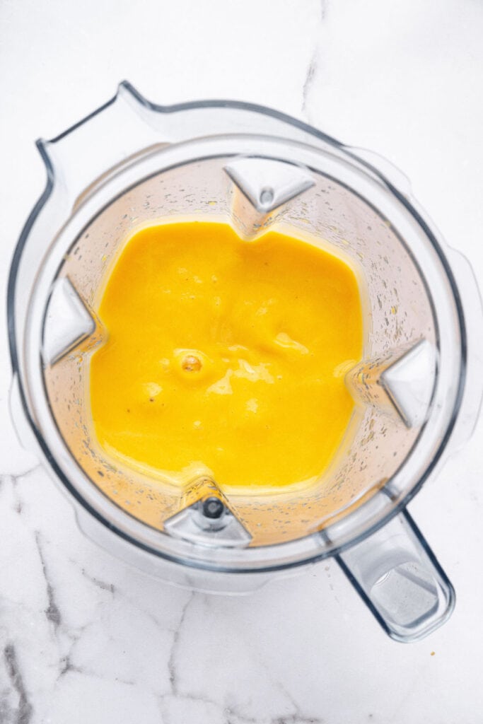 Overhead view of peach puree in blender