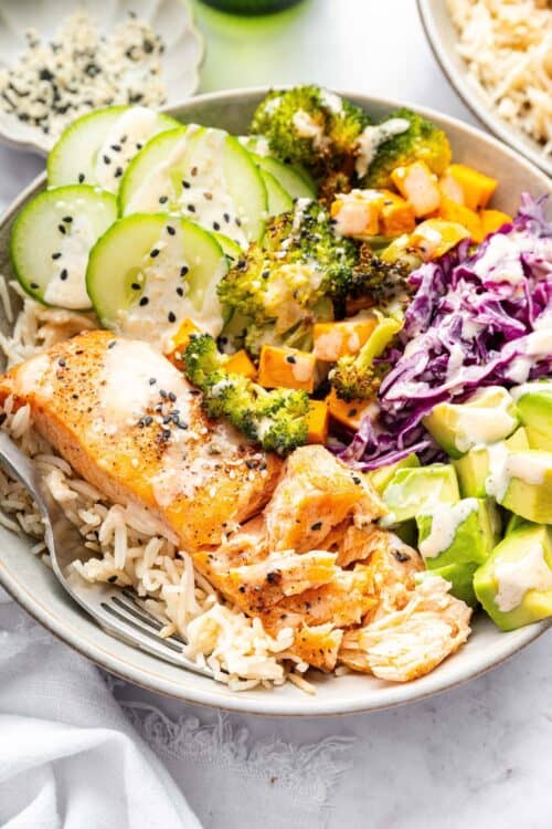 Top-down view of salmon power bowl with fork