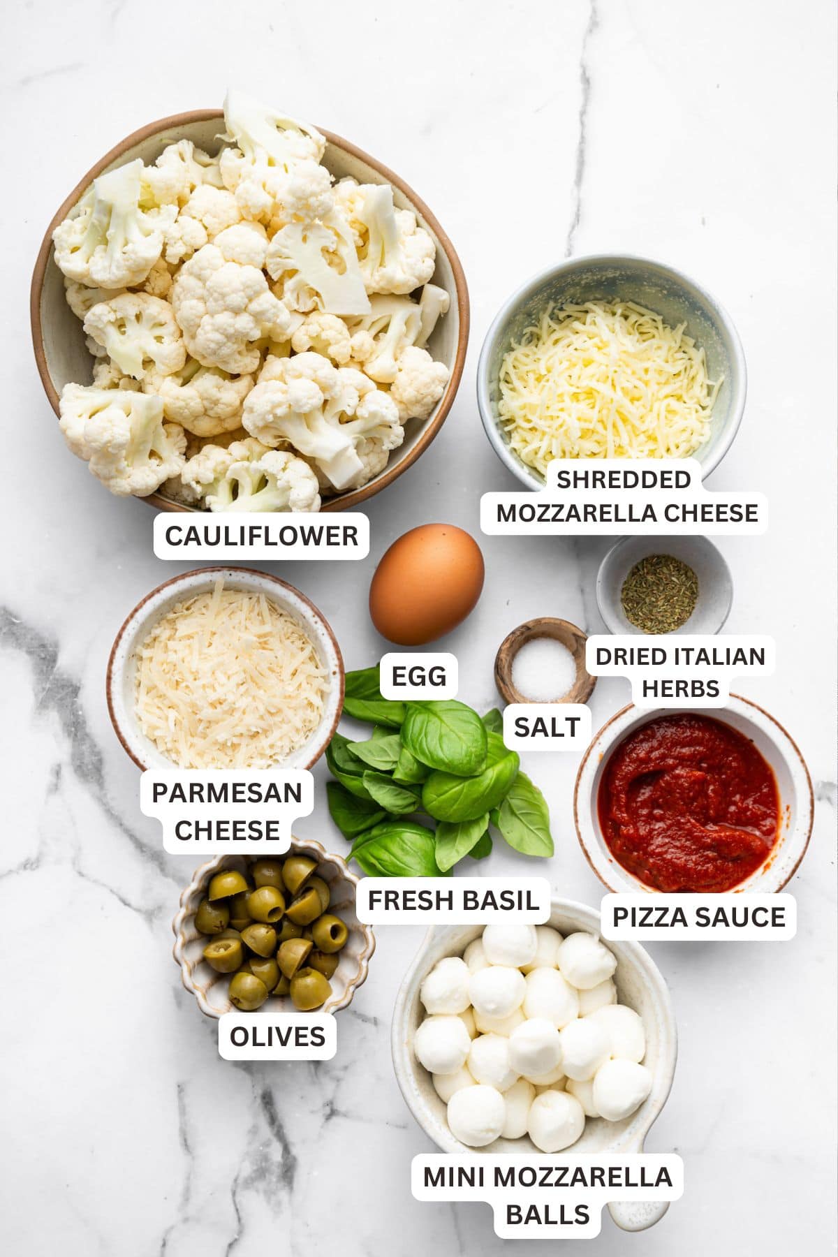 Overhead view of ingredients for cauliflower crust pizza