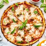 Overhead view of sliced cauliflower crust pizza