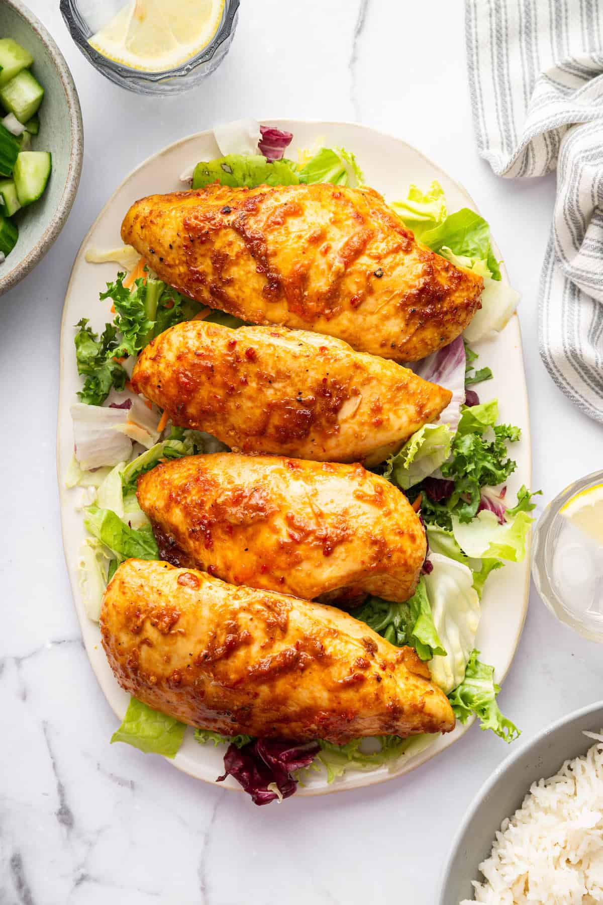 Platter of harissa honey chicken and lettuce.