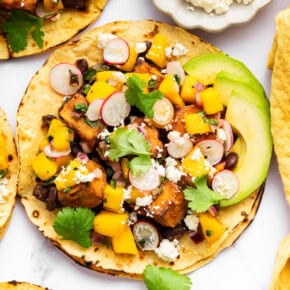 Overhead view of air fryer tofu taco with mango salsa and toppings