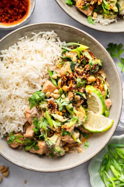 Salmon curry in bowl with white rice.