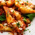 Spinach stuffed shells on plate.