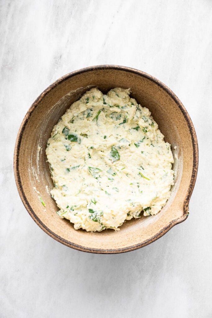 Spinach ricotta filling in bowl.