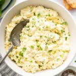 Classic egg salad in bowl with spoon.