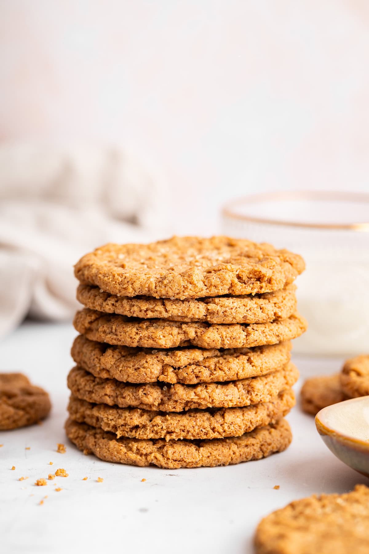 These easy almond butter cookies are made with just 5 ingredients! Naturally gluten-free, chewy with crisp edges, and full of nutty flavor. Stack of 7 almond butter cookies.
