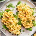Two slices of toast on plate with cottage cheese egg salad.