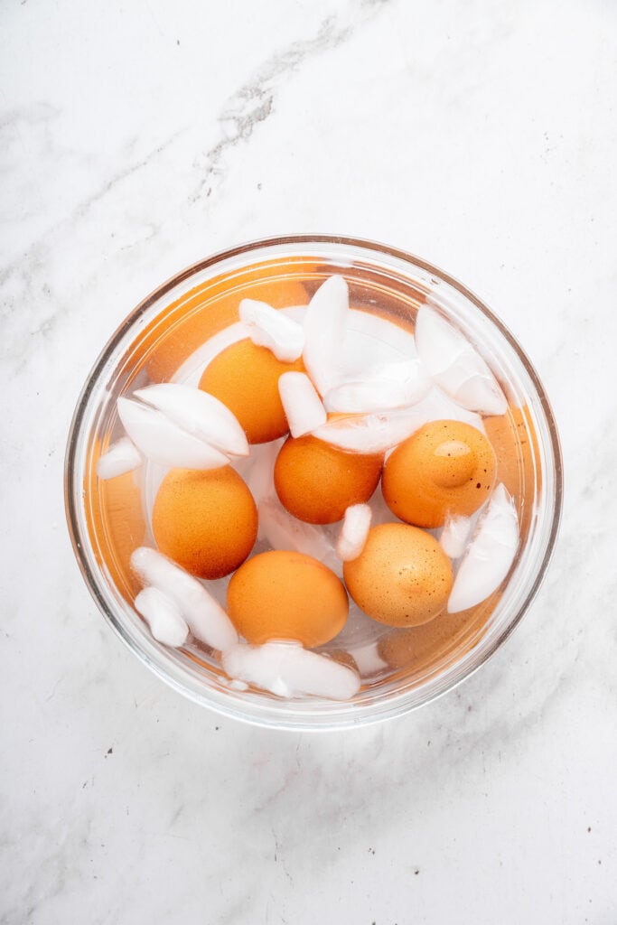 This creamy cottage cheese egg salad is a lighter version of the classic made without mayo. Higher in protein and perfect for meal prep! Hard boiled eggs in ice bath.