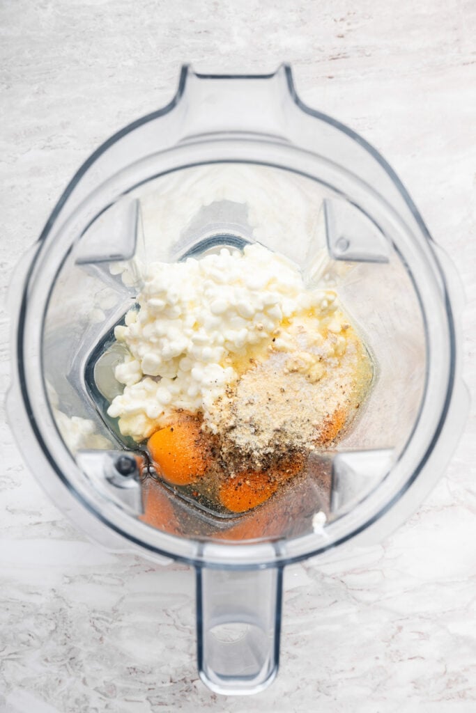 These high protein cottage cheese wraps are made with eggs and pantry seasonings—that’s it. An easy low carb alternative that tastes delish! Ingredients for cottage cheese wraps in blender.