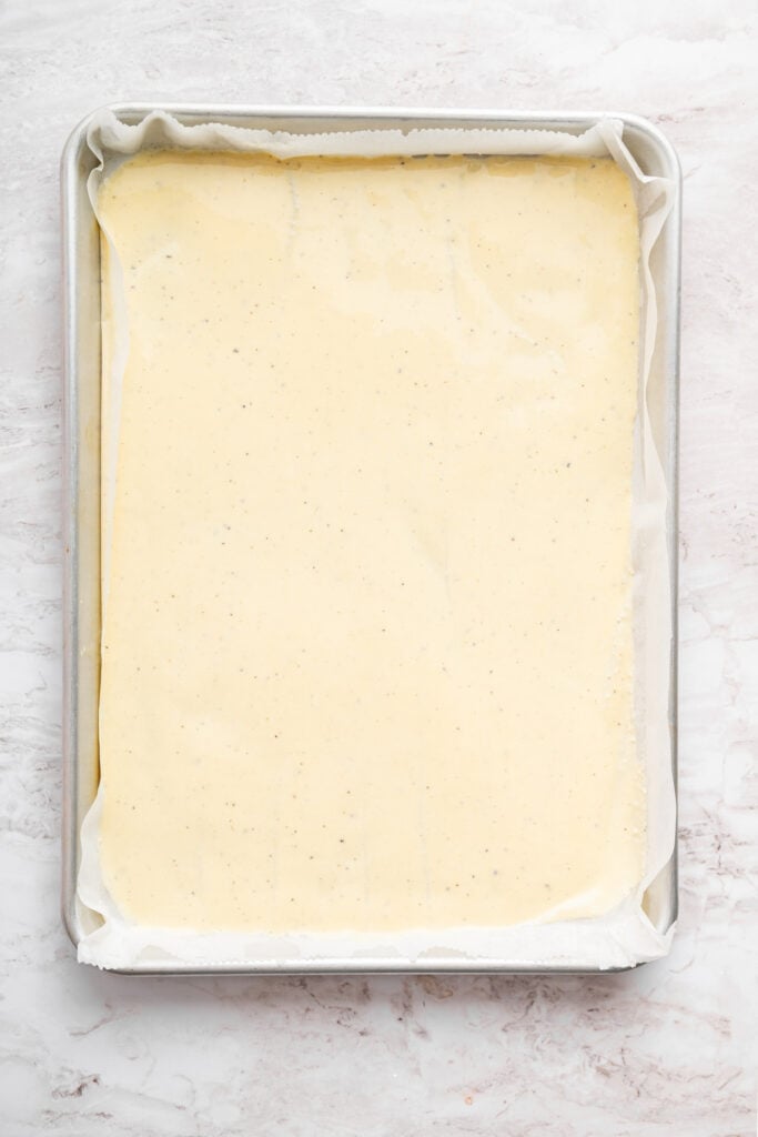 These high protein cottage cheese wraps are made with eggs and pantry seasonings—that’s it. An easy low carb alternative that tastes delish! Unbaked cottage cheese wrap in sheet pan.