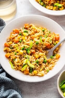 Bowl of vegetable fried rice with fork.