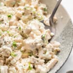 Spoonful of cottage cheese chicken salad in bowl.