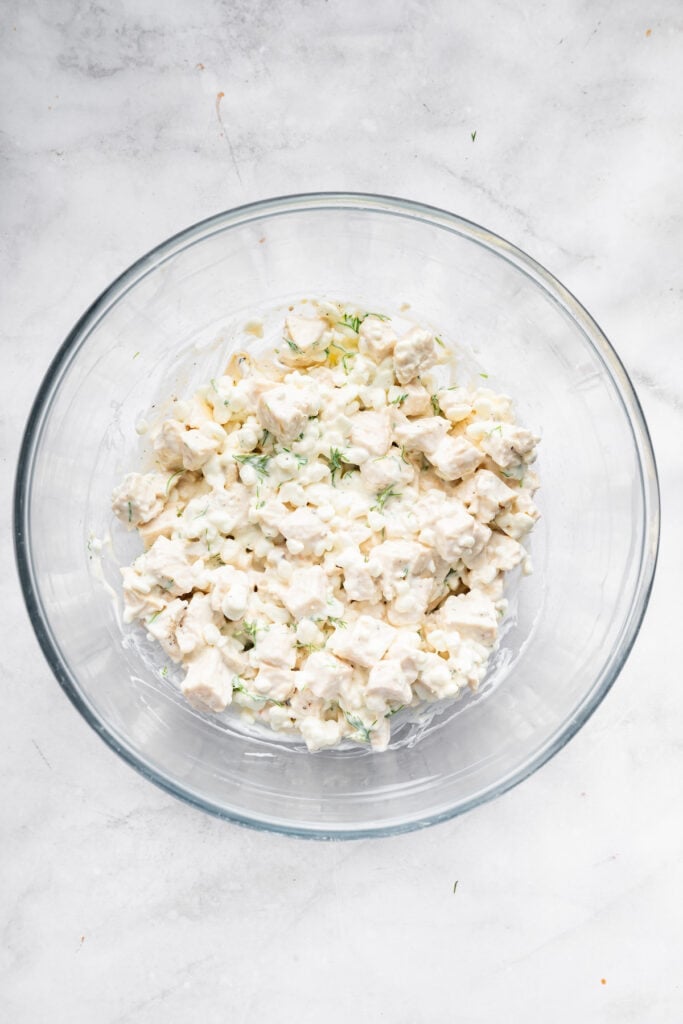 Cottage cheese chicken salad in glass bowl.