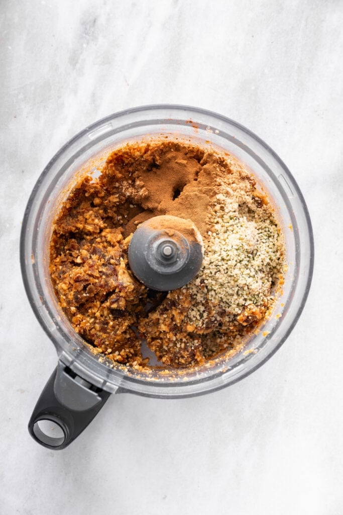 Ingredients for peanut butter protein balls in food processor.