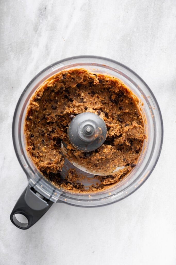 Dough for peanut butter protein balls in food processor.