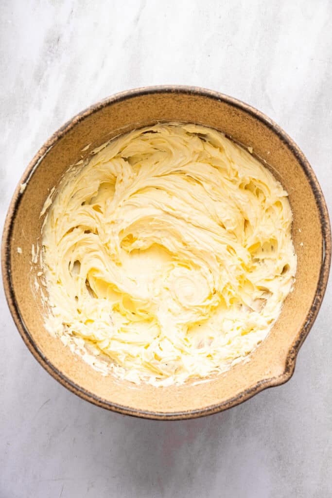This roasted garlic butter recipe is one of the easiest ways to make just about anything taste even better. You only need 2 ingredients! Roasted garlic butter in mixing bowl.