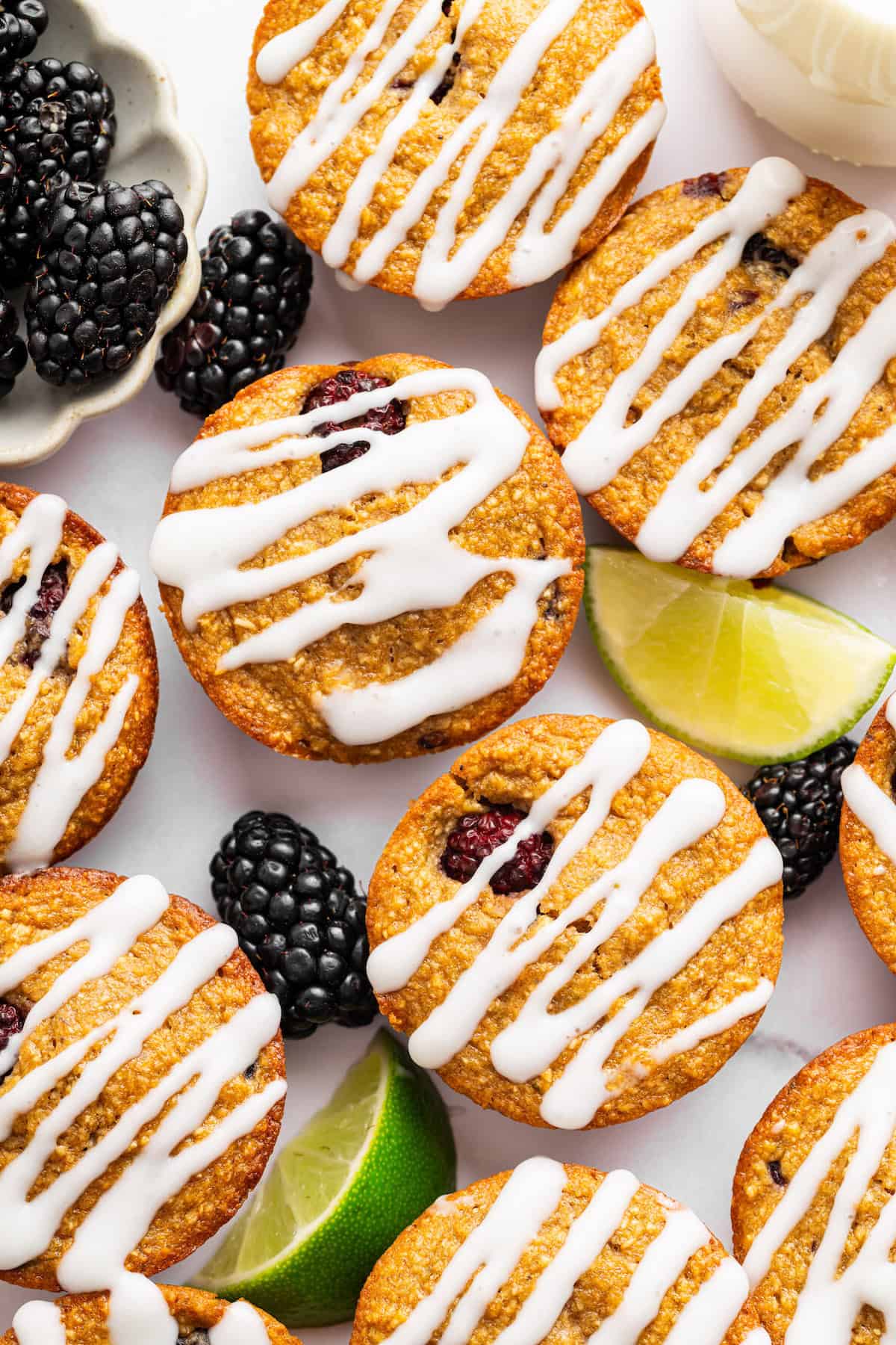 Topped with a smooth coconut-lime glaze, these easy, tender, GF blackberry muffins are a fabulous way to celebrate berry season. Blackberry lime muffins with coconut-lime glaze.