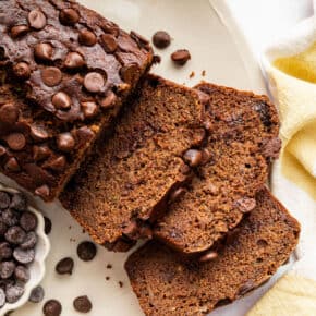 Sliced chocolate zucchini bread on a plate.