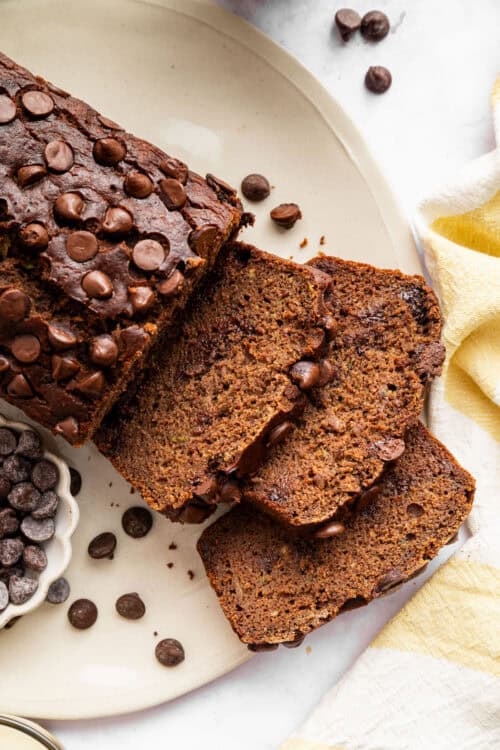 Sliced chocolate zucchini bread on a plate.
