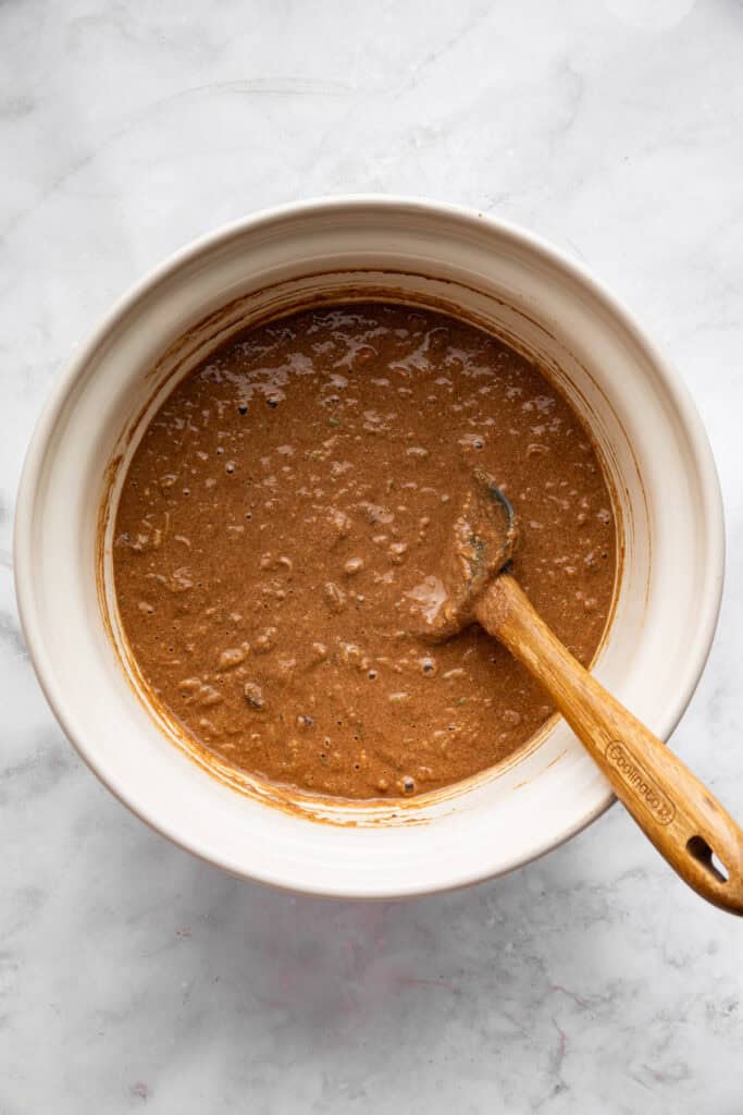 This vegan chocolate chip zucchini bread is incredibly tender, and the rich, earthy chocolate-zucchini combo is to die for. Vegan, gluten-free chocolate zucchini batter in a bowl.