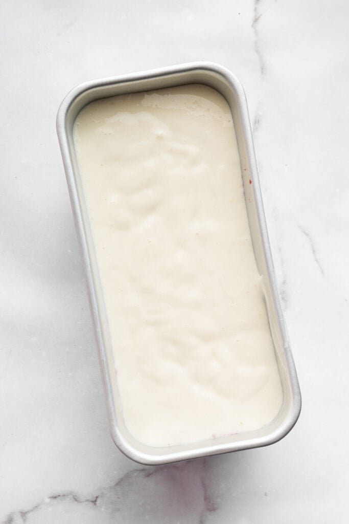 This Greek yogurt ice cream is smooth, creamy, packed with protein, and lightly sweetened with honey and a colorful swirl of fresh berries. Top with the remaining yogurt base. Freeze for 4 hours.
