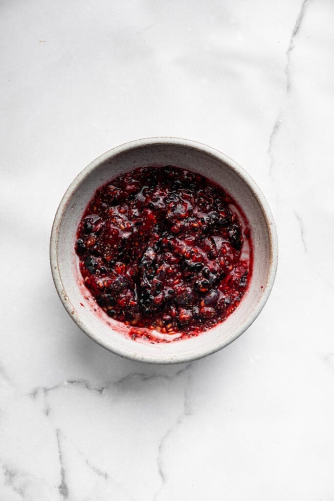 This Greek yogurt ice cream is smooth, creamy, packed with protein, and lightly sweetened with honey and a colorful swirl of fresh berries. Mashed berries thickened with chia seeds.
