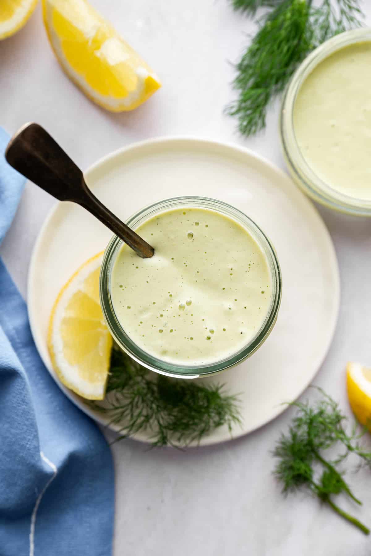 Overhead image of lemon dill sauce in a jar.